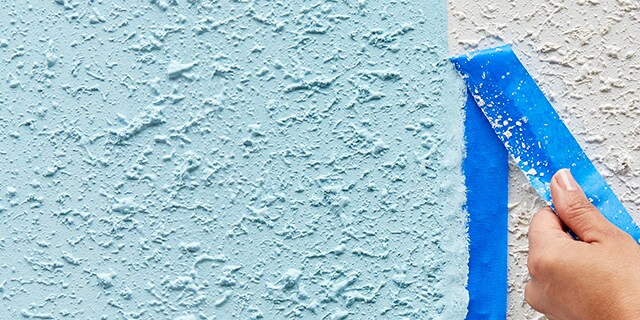 Tape being removed from a textured surface.