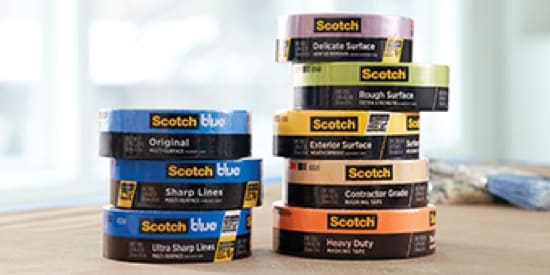 ScotchBlue™ Products and other painting tools sitting on a wood floor.