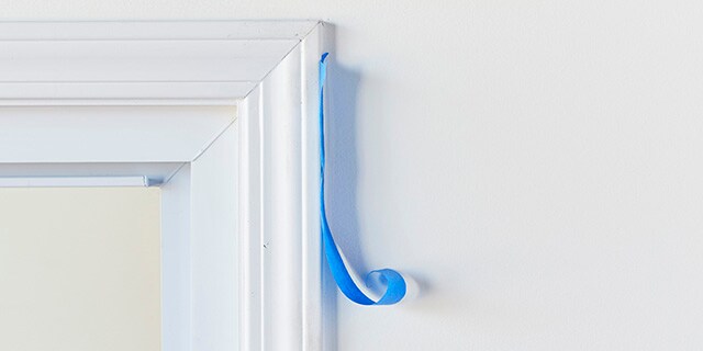 Tape peeling off of window trim.